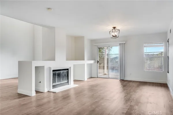 a view of livingroom with hardwood floor and a fireplace
