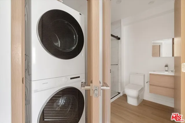 a view of a hallway with washer and dryer