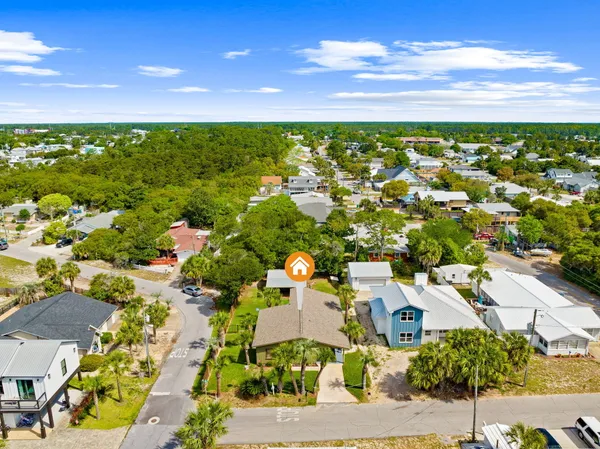 an aerial view of residential houses with outdoor space