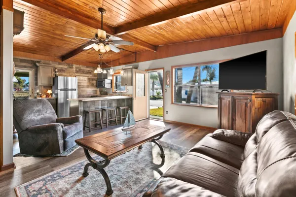 a living room with furniture a table and chairs
