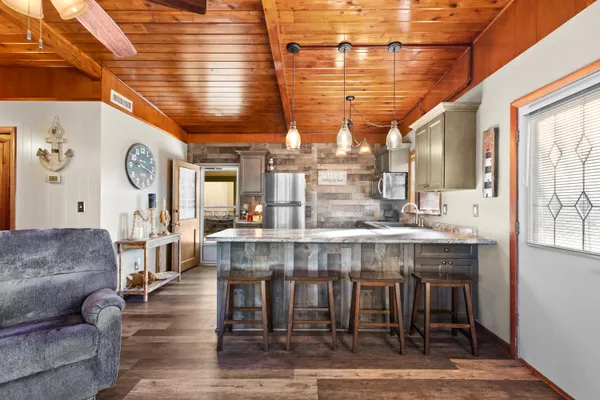 a kitchen with a table and chairs in it