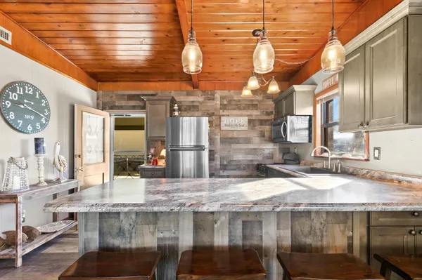 a view of a kitchen with a table and chairs