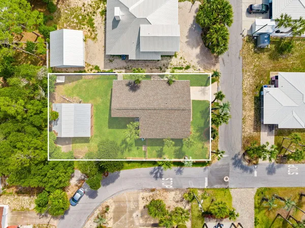 an aerial view of a house with a swimming pool
