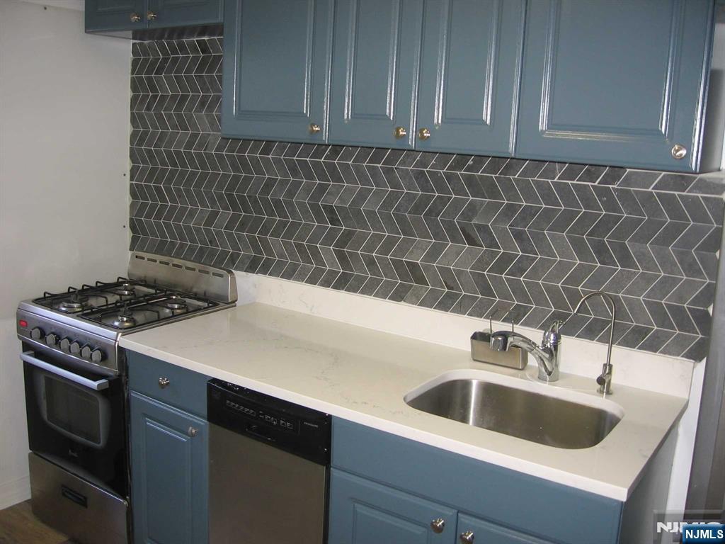 67 Clark Court Rutherford, NJ 07070 - Photo 11 of 12 a kitchen with a sink and cabinets