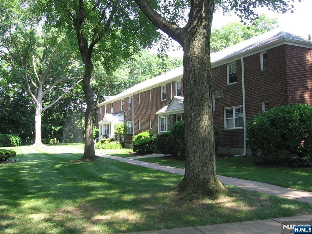 67 Clark Court Rutherford, NJ 07070 - Photo 2 of 12 a front view of a house with garden