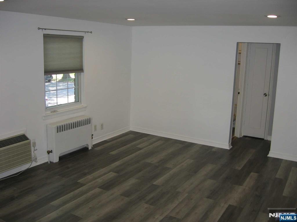 67 Clark Court Rutherford, NJ 07070 - Photo 5 of 12 an empty room with wooden floor and windows