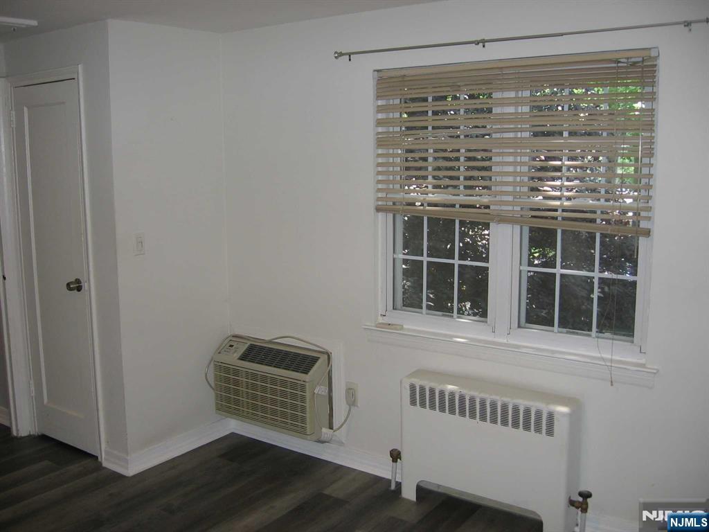 67 Clark Court Rutherford, NJ 07070 - Photo 8 of 12 a view of an empty room with wooden floor and windows