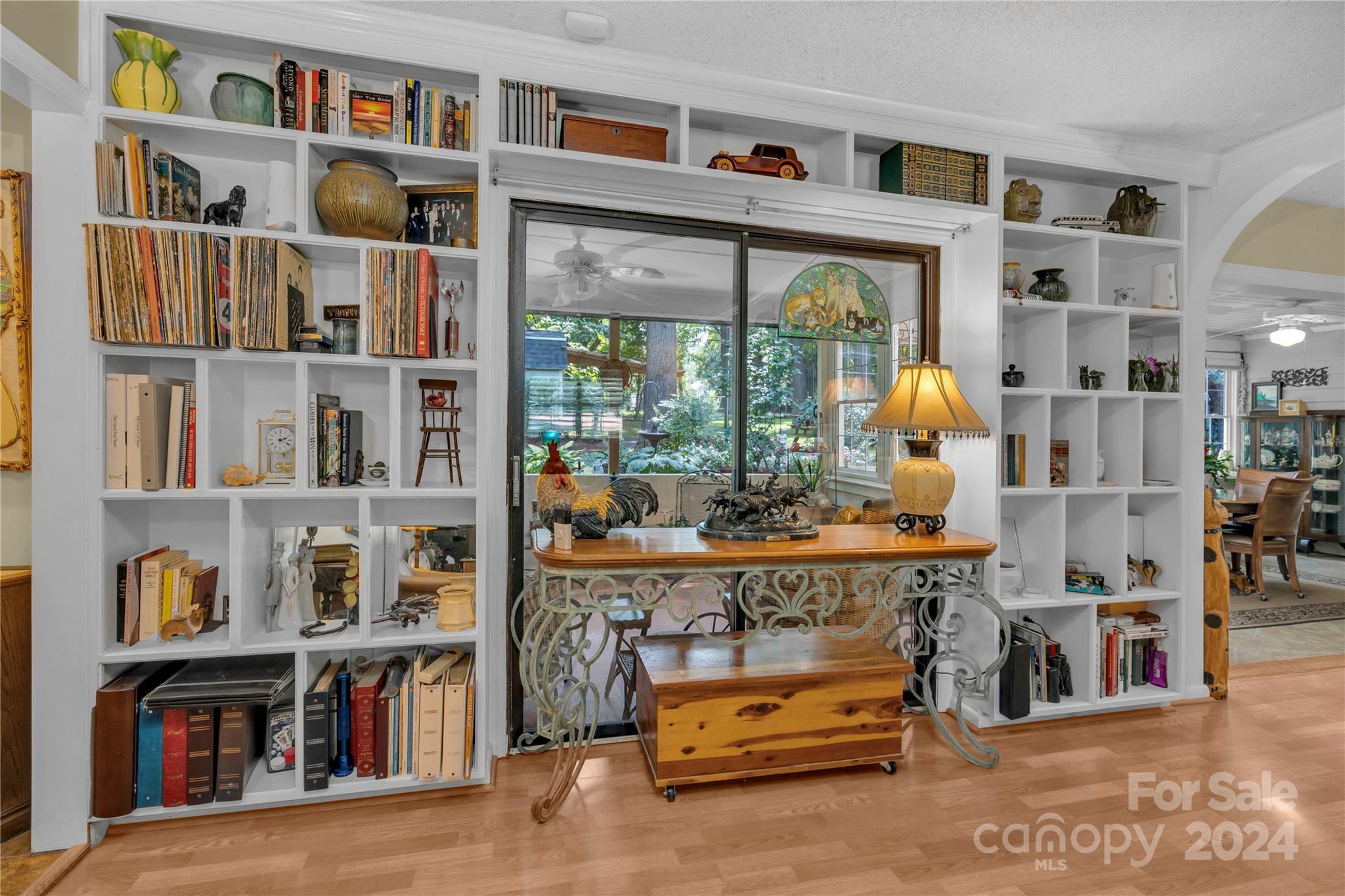 300 Gray Drive Charlotte, NC 28213 - Photo 12 of 40 a living room with lots of books and a large tree