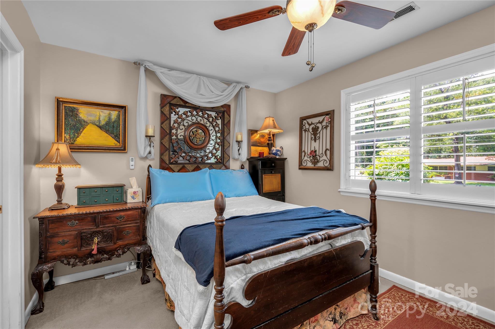 300 Gray Drive Charlotte, NC 28213 - Photo 14 of 40 a bedroom with a bed and a chandelier