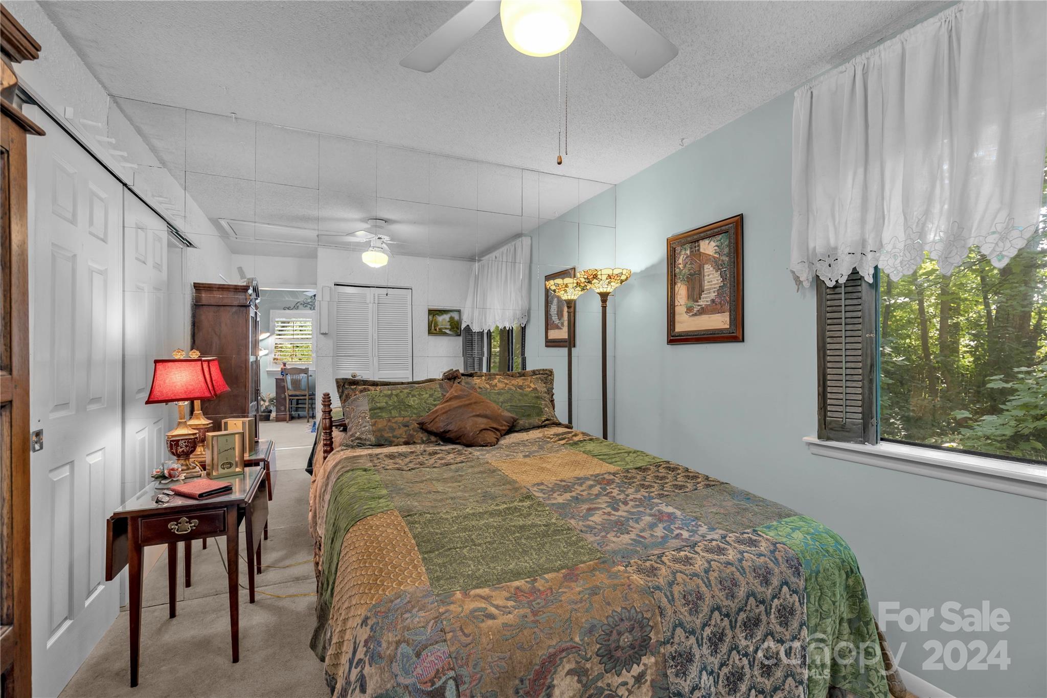 300 Gray Drive Charlotte, NC 28213 - Photo 15 of 40 a bedroom with a bed and a chandelier