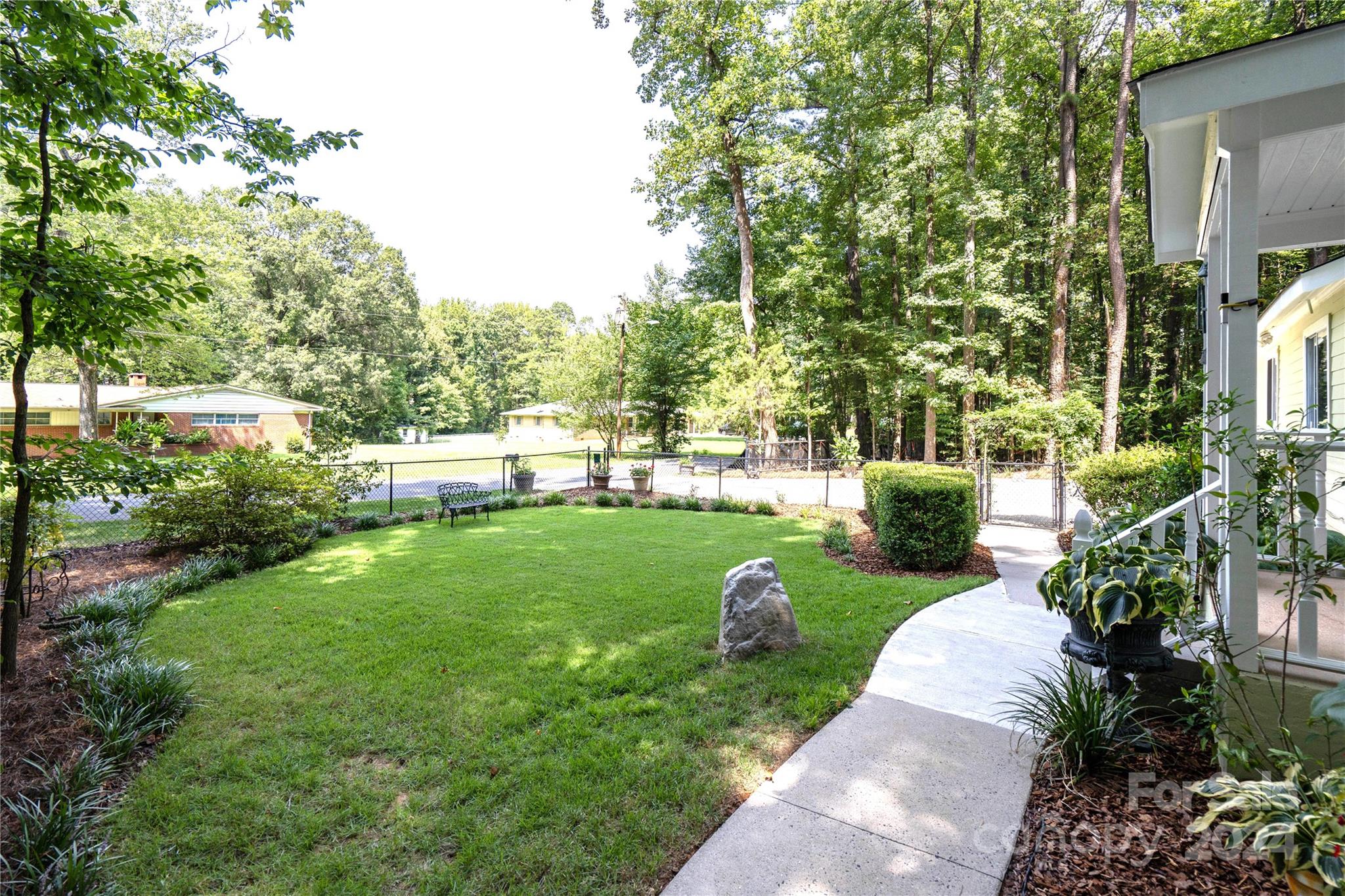 300 Gray Drive Charlotte, NC 28213 - Photo 2 of 40 a view of a garden with large trees