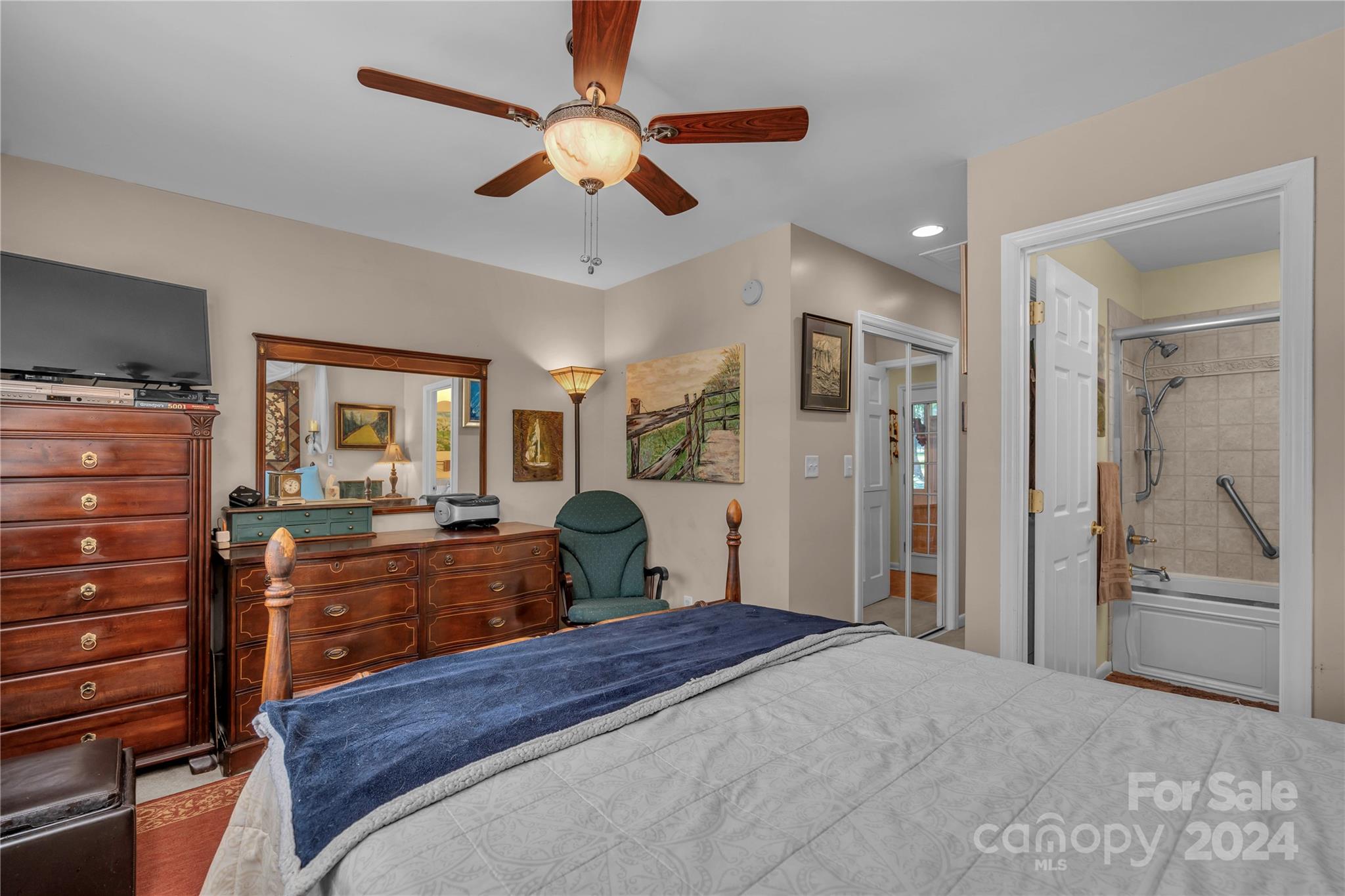 300 Gray Drive Charlotte, NC 28213 - Photo 24 of 40 a bedroom with a bed and a chandelier