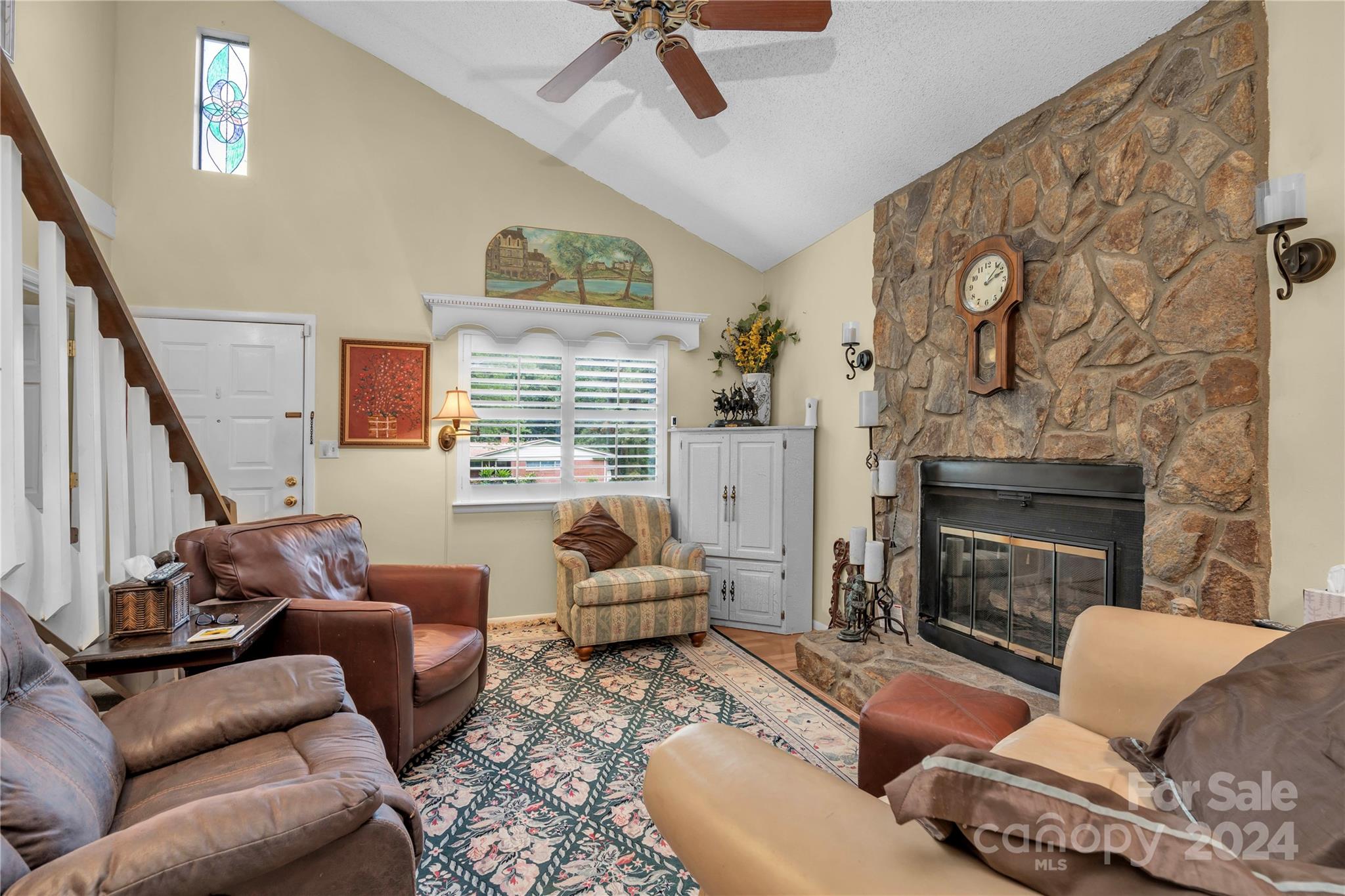 300 Gray Drive Charlotte, NC 28213 - Photo 31 of 40 a living room with furniture and a fireplace