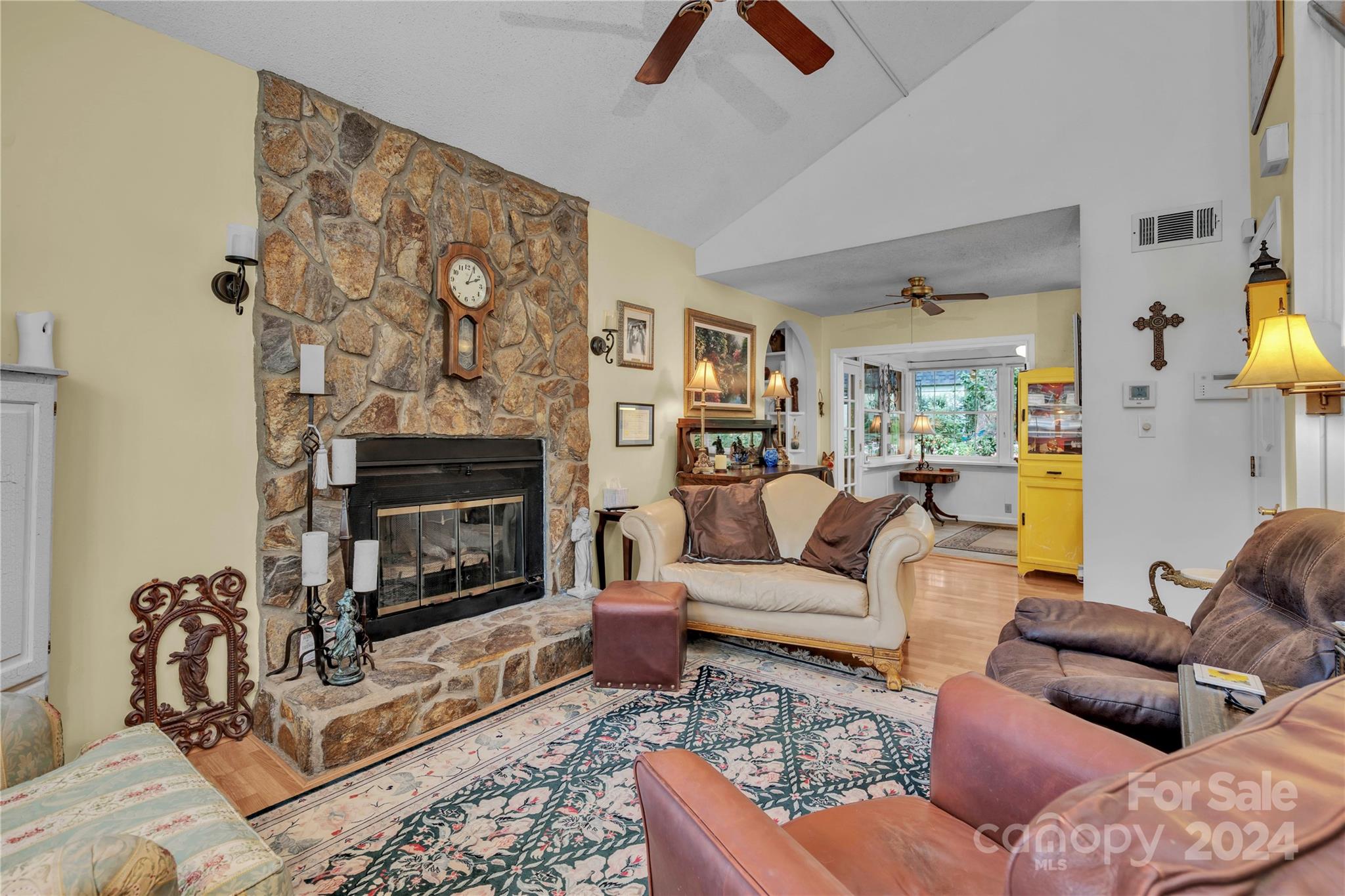 300 Gray Drive Charlotte, NC 28213 - Photo 6 of 40 a living room with furniture a fireplace and a flat screen tv