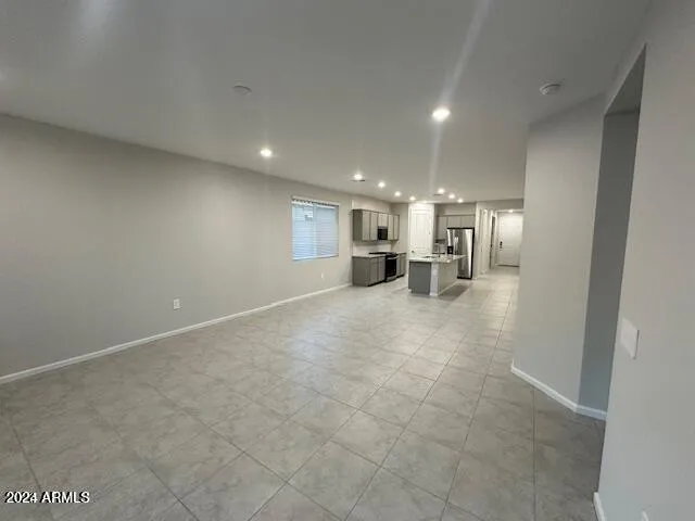 a view of a big room with windows