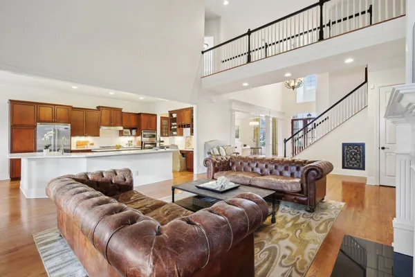 a view of living room with furniture and wooden floor