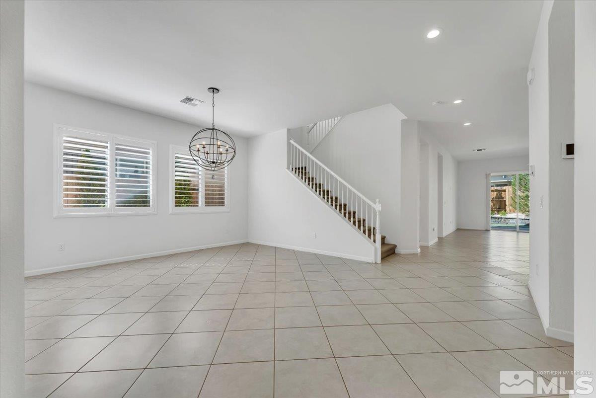 9405 Baldacci Road Reno, NV 89521 - Photo 12 of 40 wooden floor in an empty room with a window