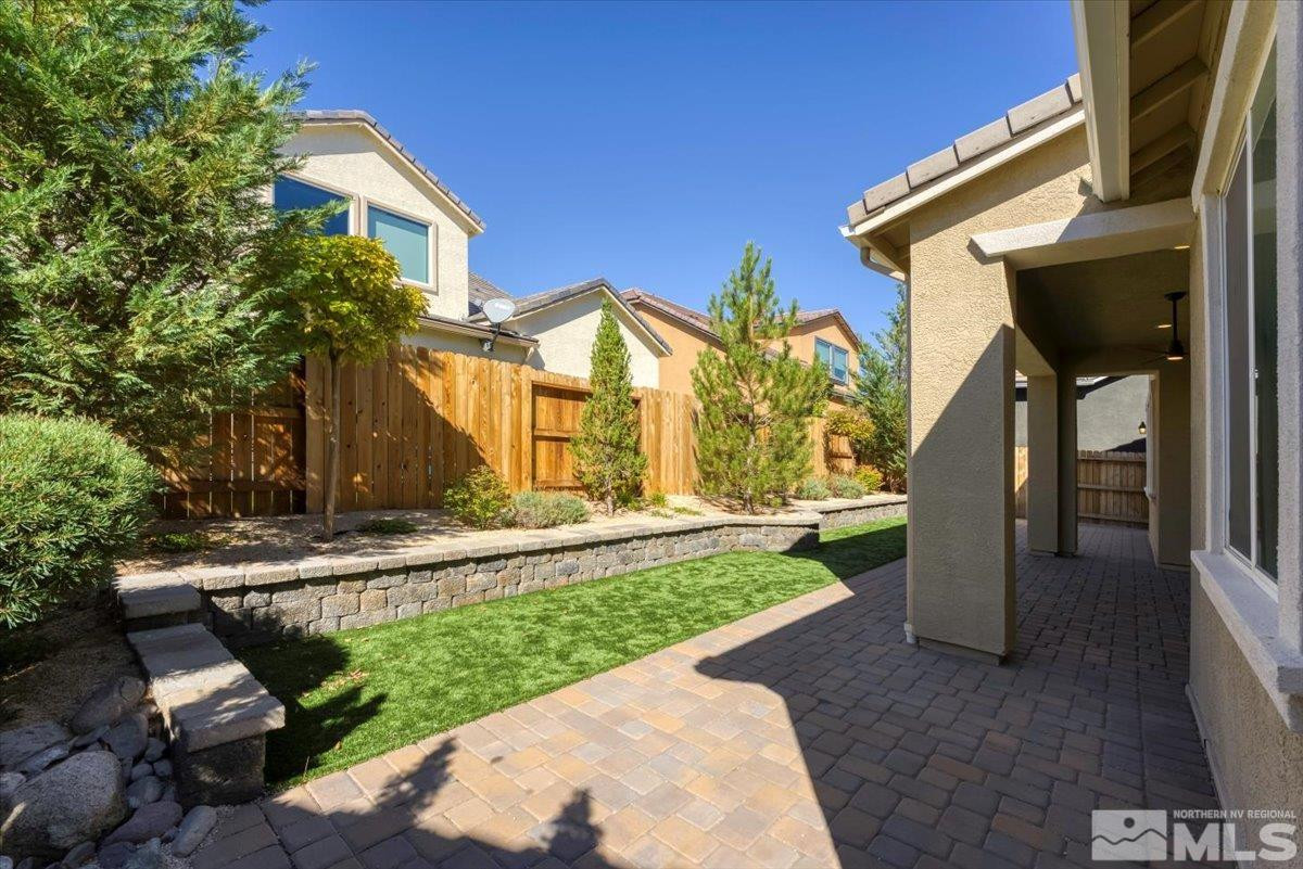 9405 Baldacci Road Reno, NV 89521 - Photo 21 of 40 a view of a house with a yard