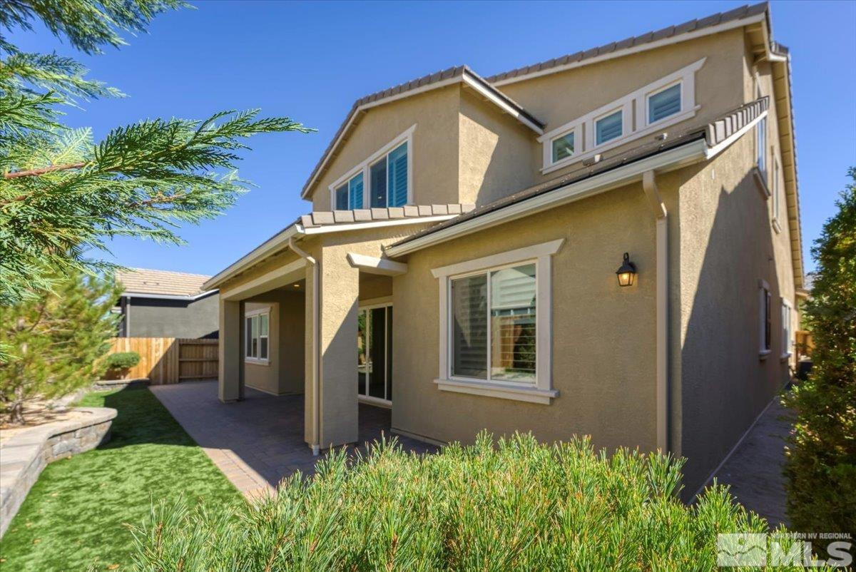 9405 Baldacci Road Reno, NV 89521 - Photo 22 of 40 a front view of a house with garden