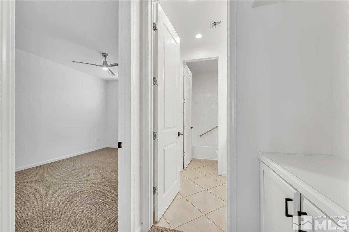 9405 Baldacci Road Reno, NV 89521 - Photo 28 of 40 a view of a bathroom with a shower and a sink