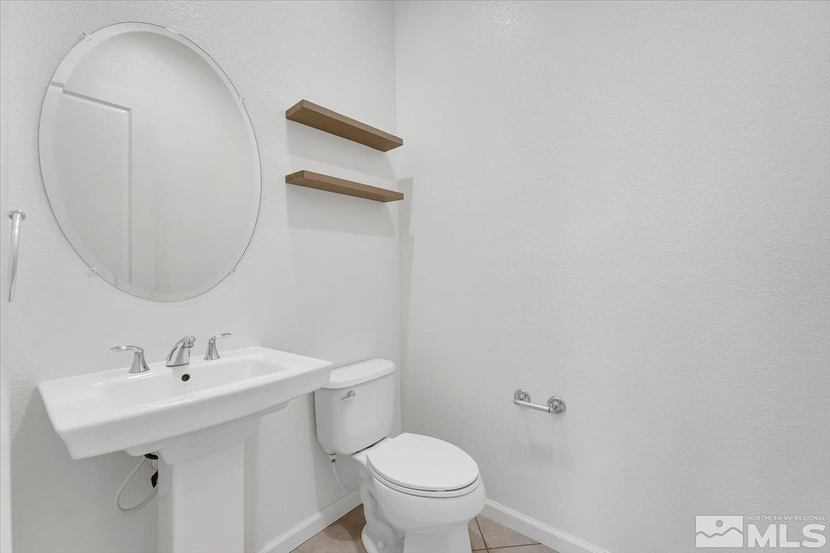 9405 Baldacci Road Reno, NV 89521 - Photo 33 of 40 a bathroom with a sink mirror and toilet