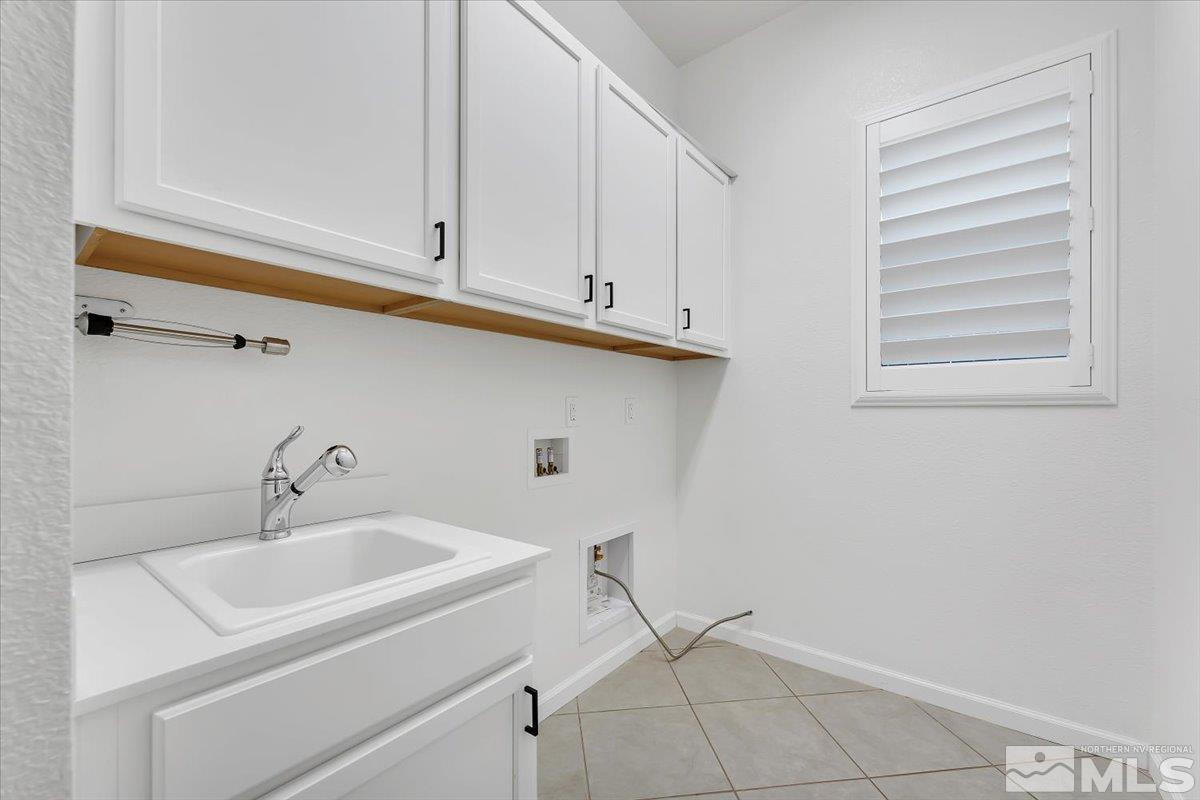 9405 Baldacci Road Reno, NV 89521 - Photo 34 of 40 a bathroom with a sink and cabinets