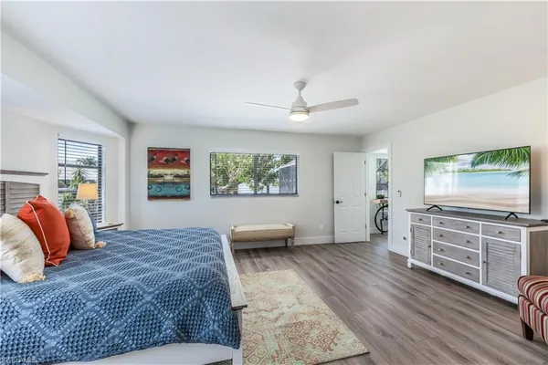 a bedroom with furniture and window