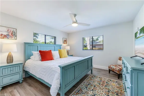 a bedroom with a bed and a dresser in it