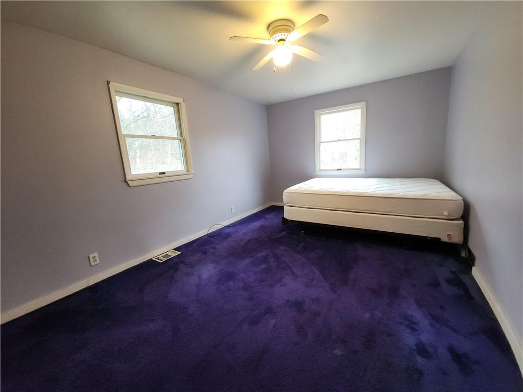 31 Wheatley Road Charleroi, PA 15022 - Photo 17 of 48 a spacious bedroom with a bed and window