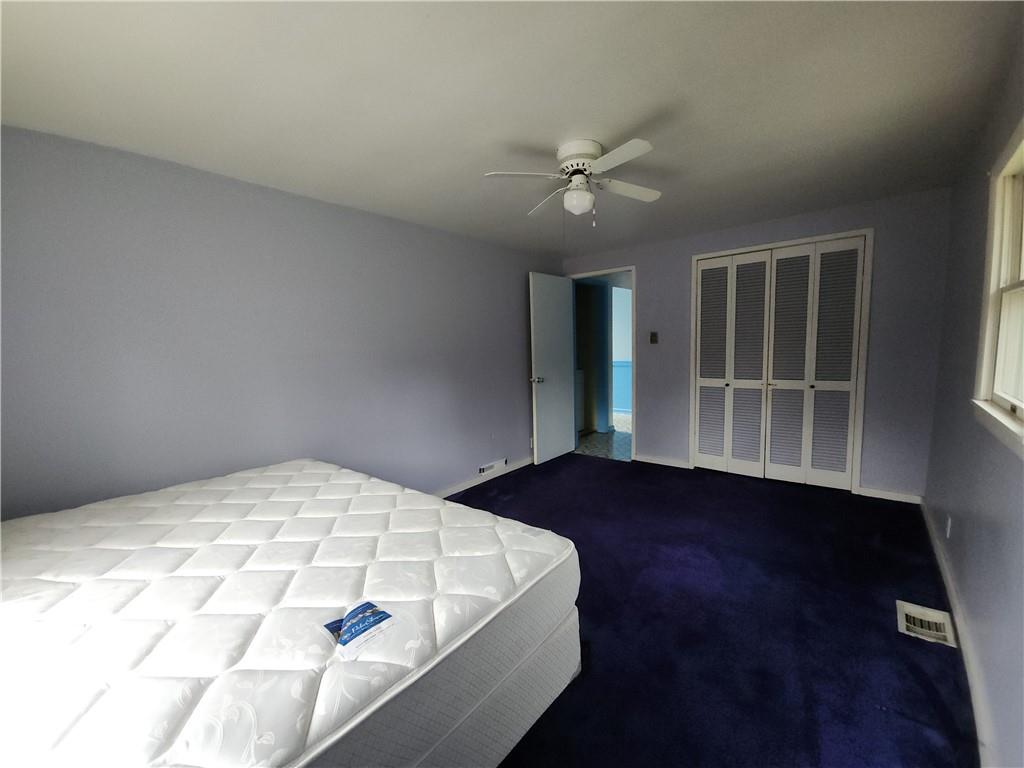 31 Wheatley Road Charleroi, PA 15022 - Photo 19 of 48 a view of an empty room with wooden floor and a window