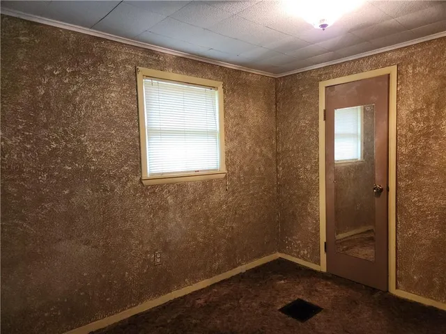 a bathroom with a toilet sink and shower