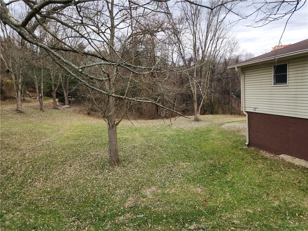 31 Wheatley Road Charleroi, PA 15022 - Photo 43 of 48 a backyard of a house with lots of green space