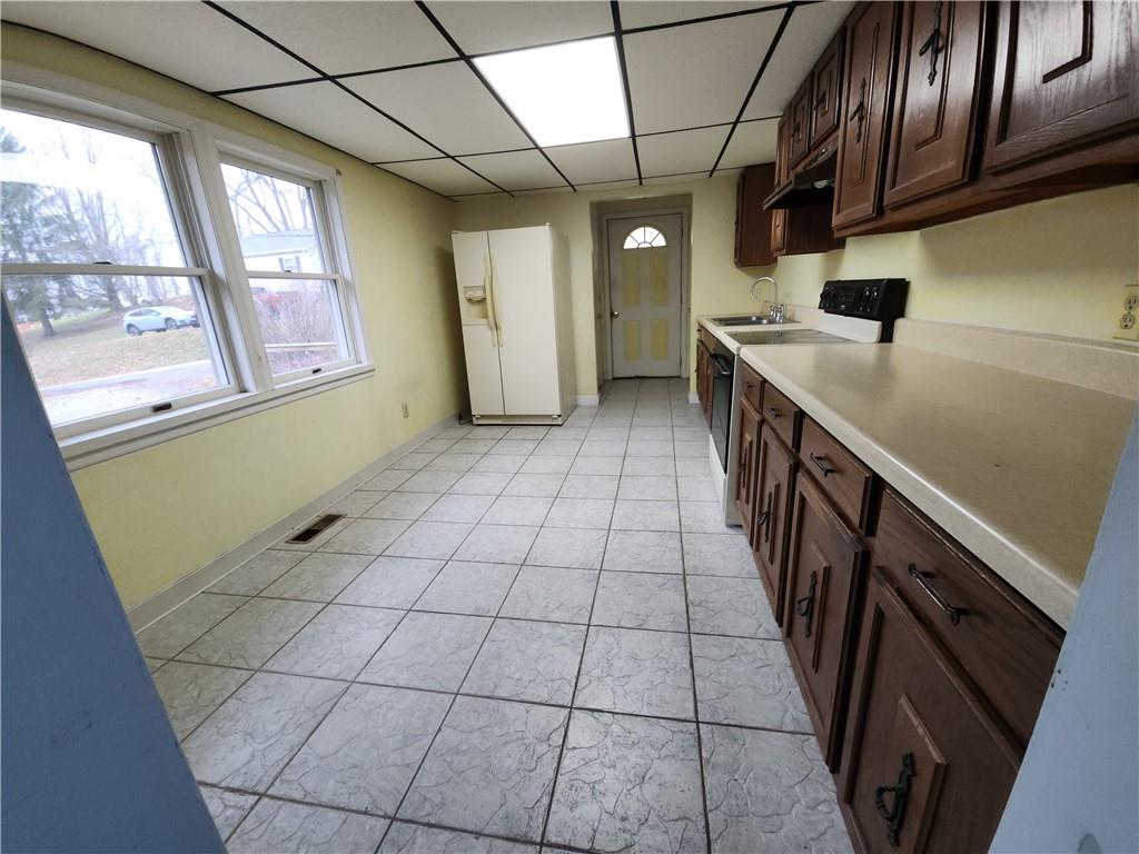 31 Wheatley Road Charleroi, PA 15022 - Photo 6 of 48 a kitchen with stainless steel appliances cabinets and a window