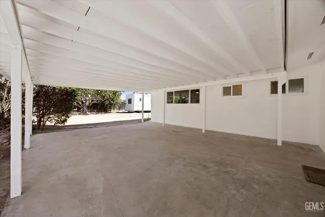 a view of a big room with windows