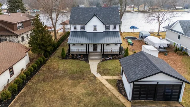 a view of multiple houses with a yard