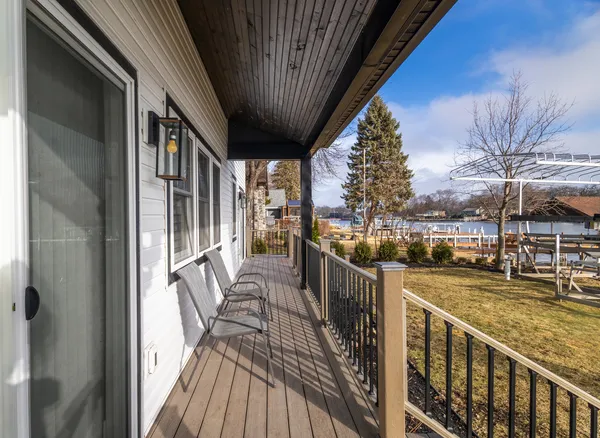 a view of a balcony with furniture