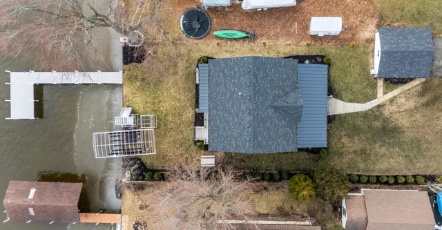 an aerial view of residential houses with outdoor space