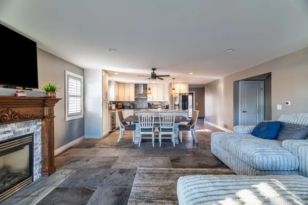 a living room with furniture and a fireplace