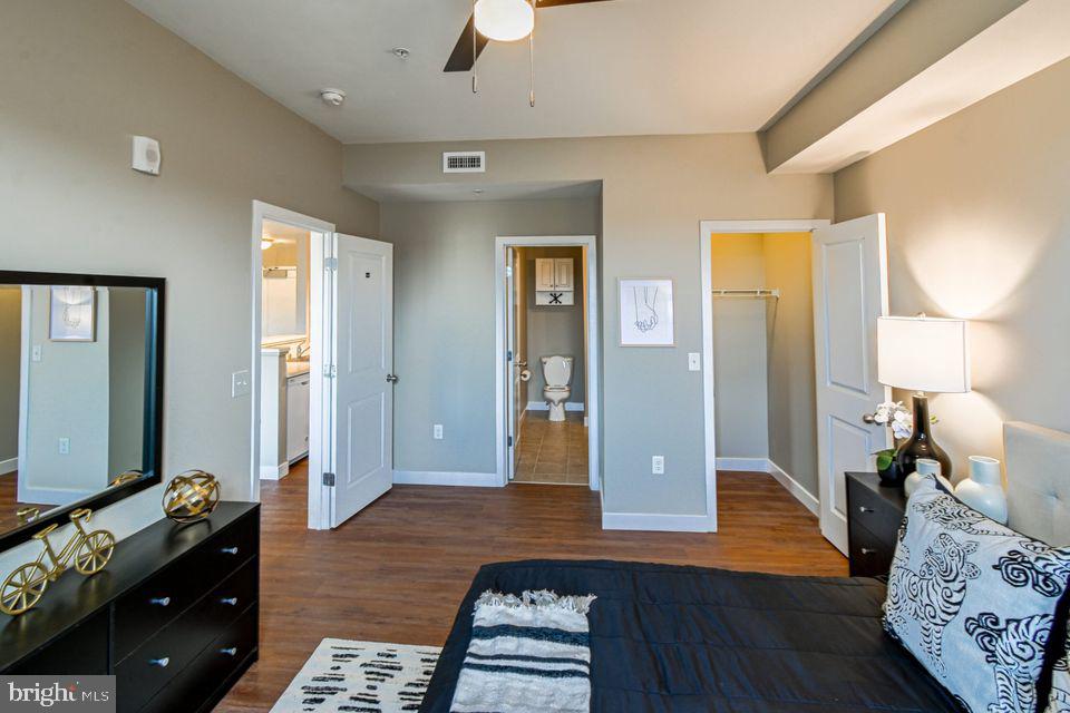10800 Clipper Circle Princess Anne, MD 21853 - Photo 12 of 14 a bedroom with a bed and wooden floor