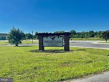 a view of a park with welcome board