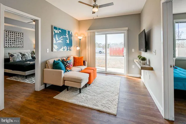 a living room with furniture and a flat screen tv