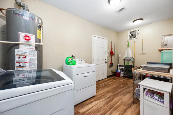 a kitchen with a refrigerator and a stove