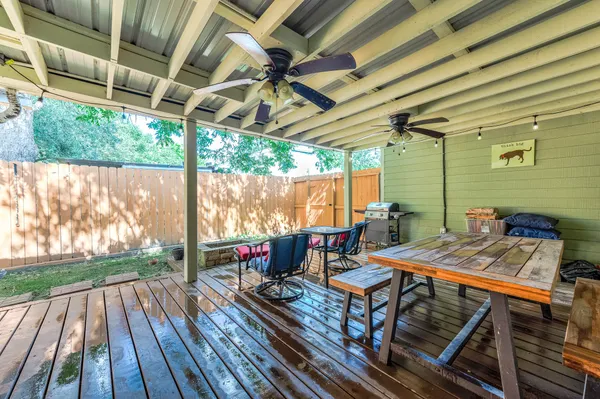a view of a backyard with sitting area