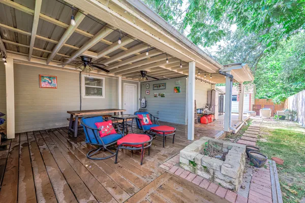 a view of backyard with a deck