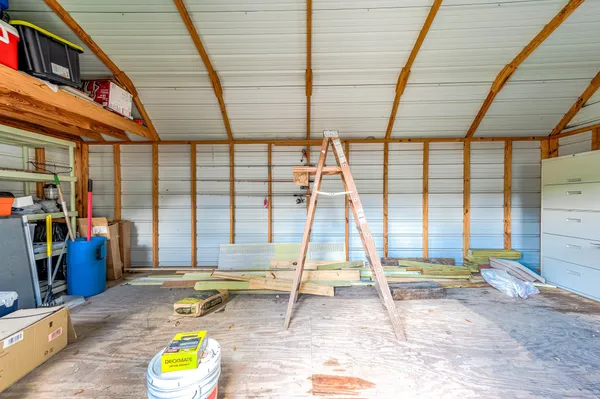 a view of a house with wooden deck