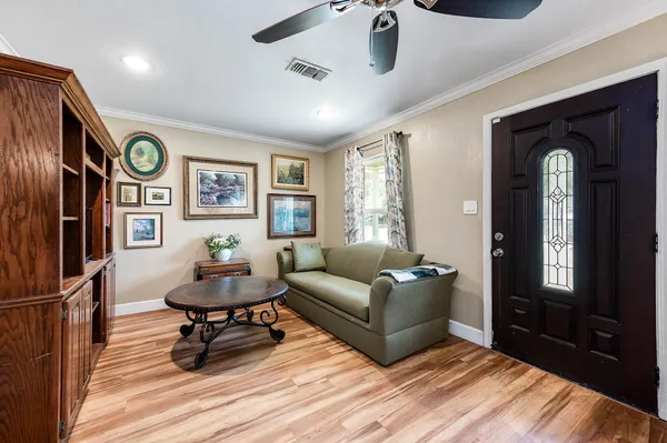 a living room with furniture and a window