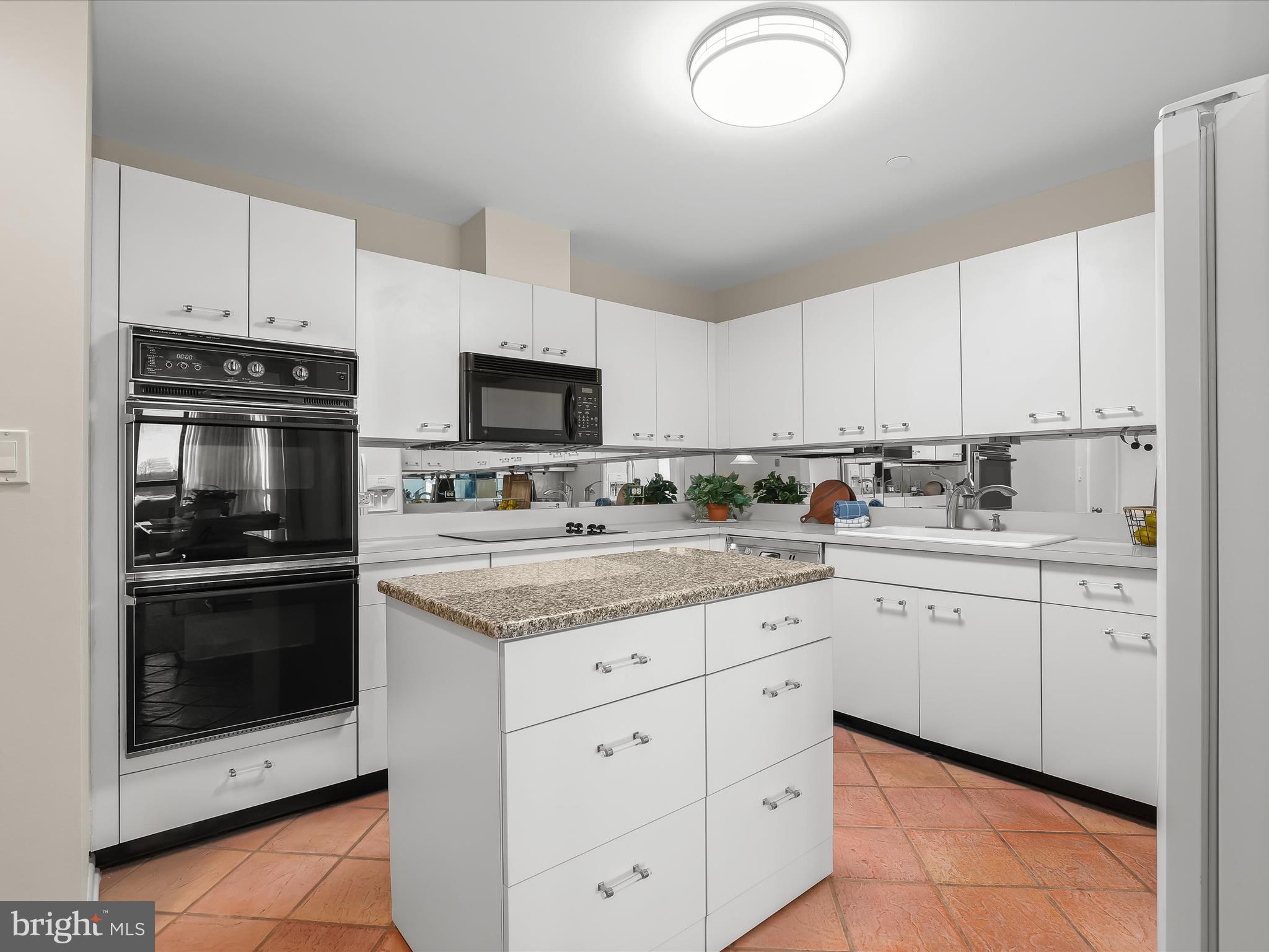 4001 Old Court Road, Unit 519 Pikesville, MD 21208 - Photo 16 of 43 a kitchen with cabinets stainless steel appliances and sink