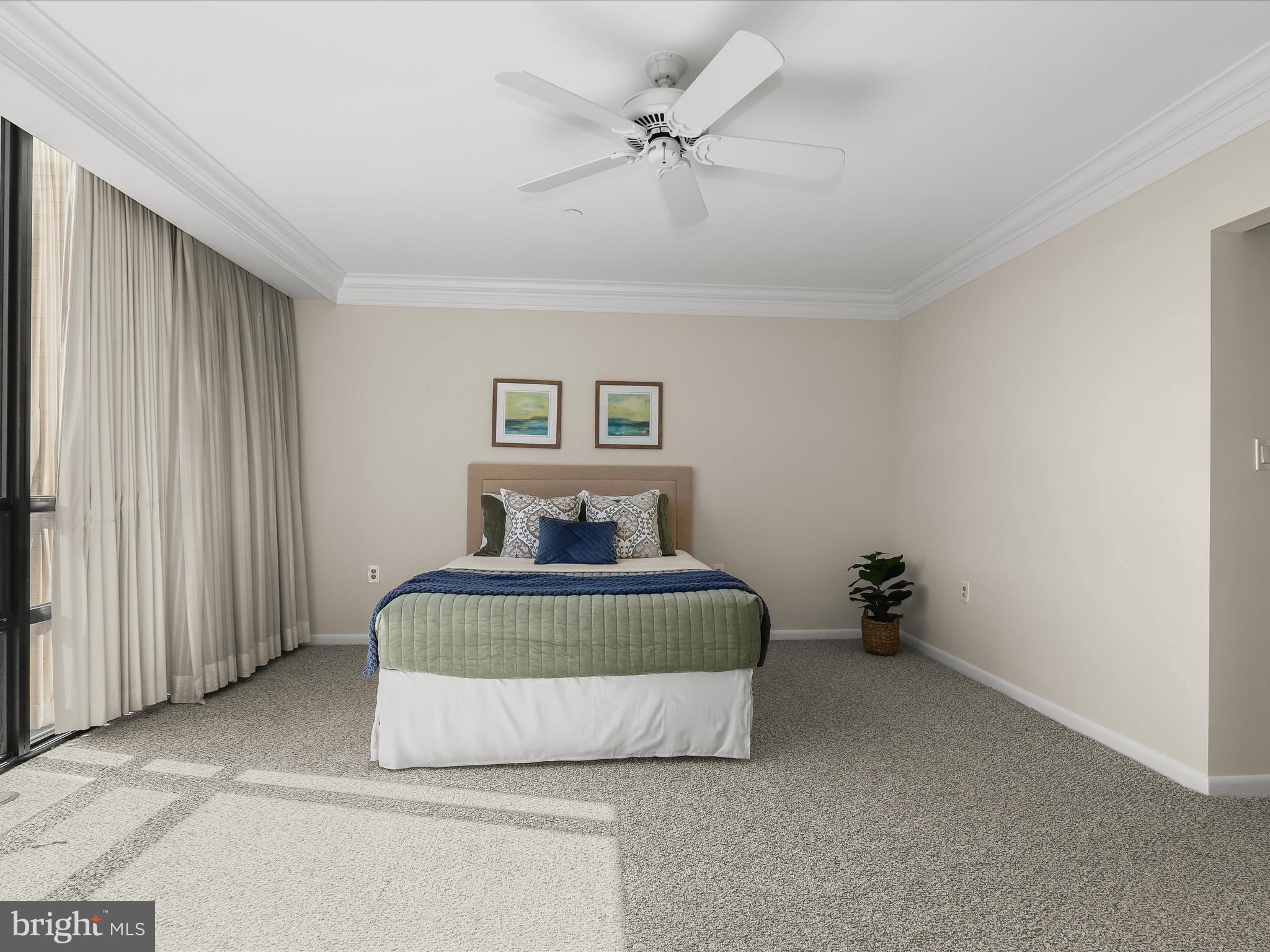 4001 Old Court Road, Unit 519 Pikesville, MD 21208 - Photo 25 of 43 a room with a bed and a chandelier