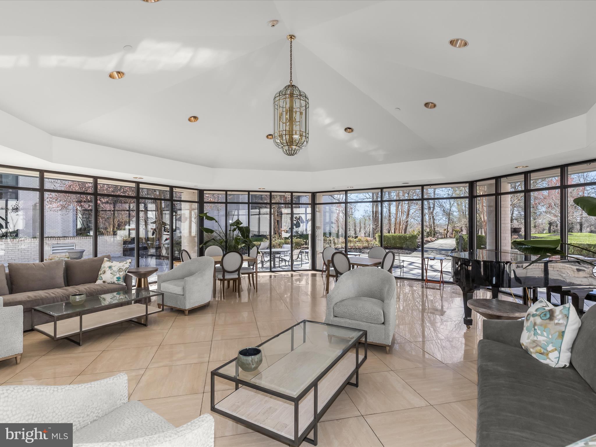 4001 Old Court Road, Unit 519 Pikesville, MD 21208 - Photo 39 of 43 a living room with furniture potted plant and large windows