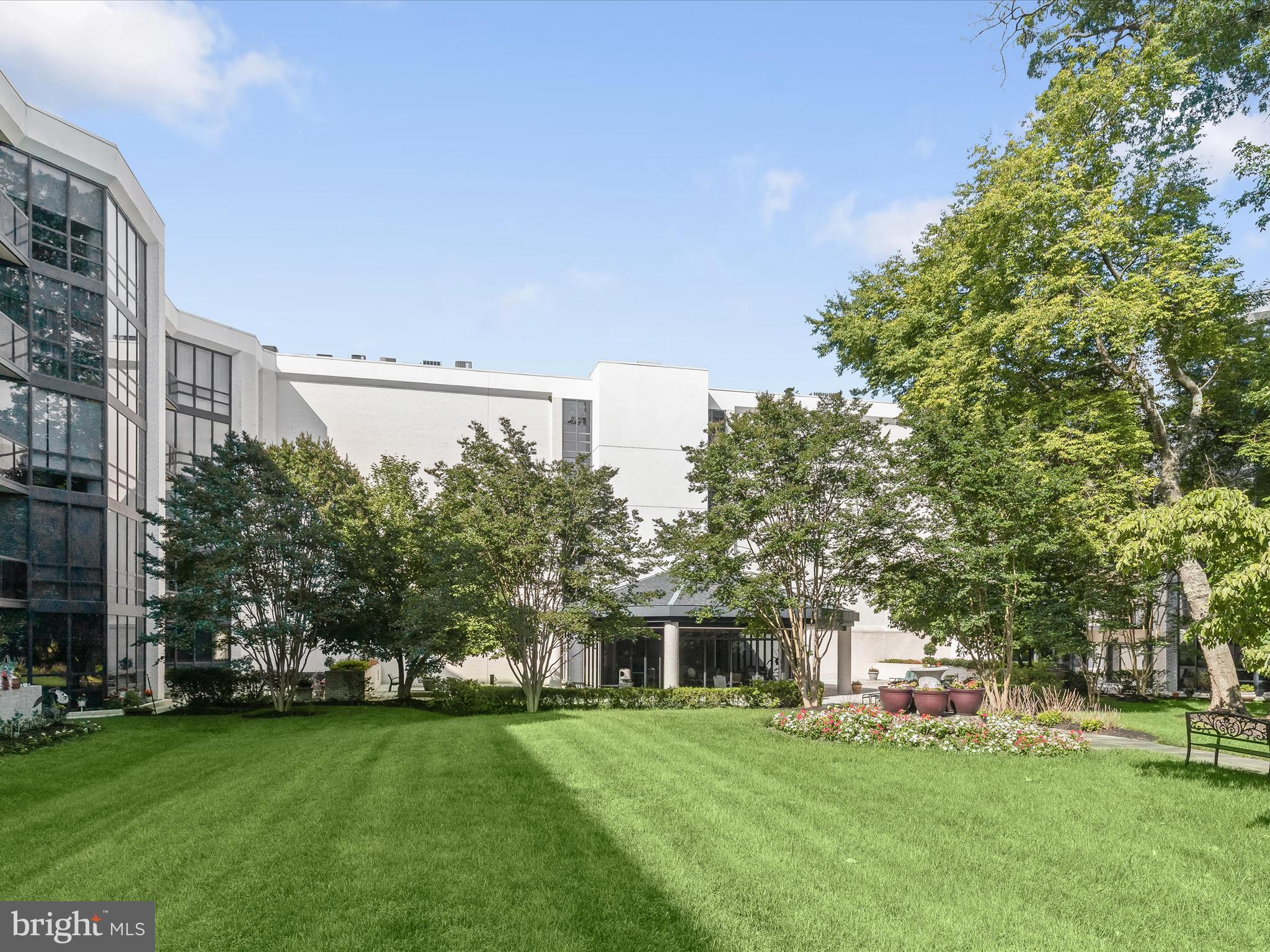 4001 Old Court Road, Unit 519 Pikesville, MD 21208 - Photo 40 of 43 a front view of a house with a garden